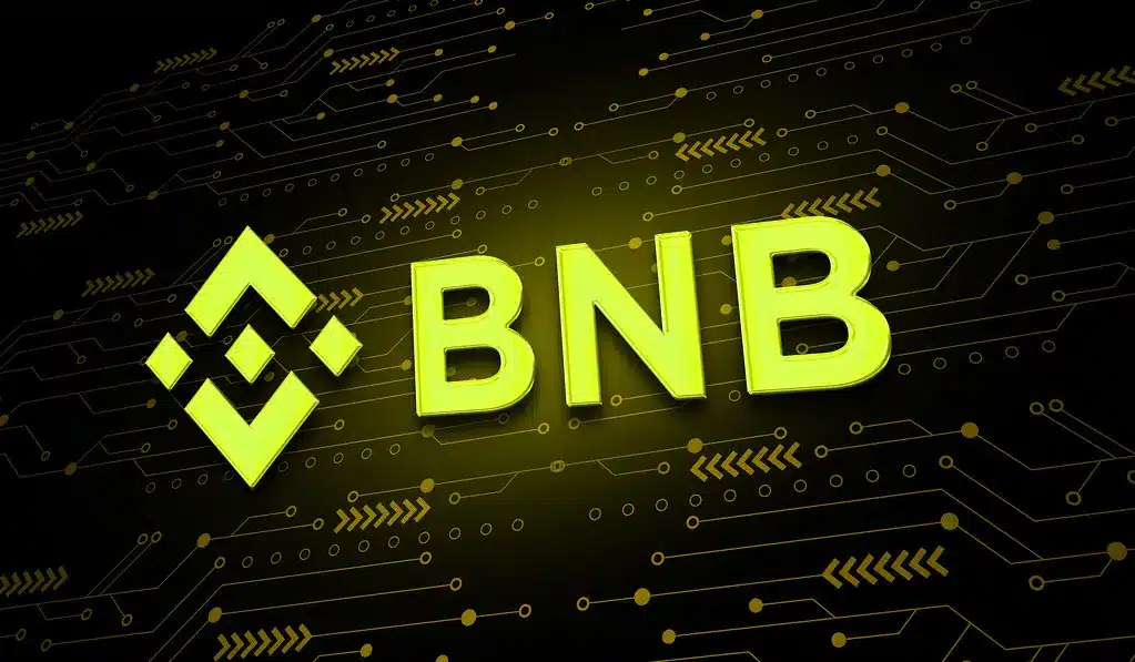 Das gelbe Logo und das Kürzel BNB von Binance vor einem dunklen Hintergrund mit Schaltkreisdesign.